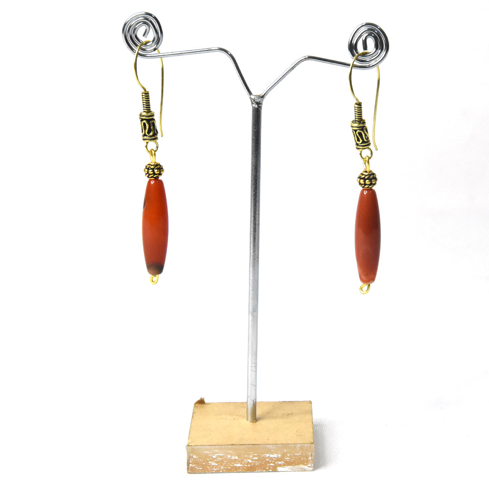 20. Naga oval-shaped jewellery (orange brownish)