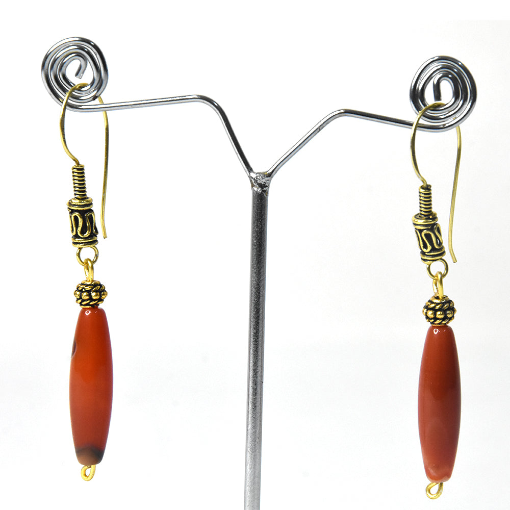 20. Naga oval-shaped jewellery (orange brownish)